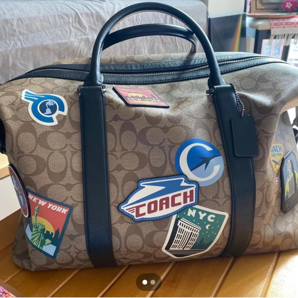 ❌Sold❌ COACH Voyager in Signature with NYC logos
